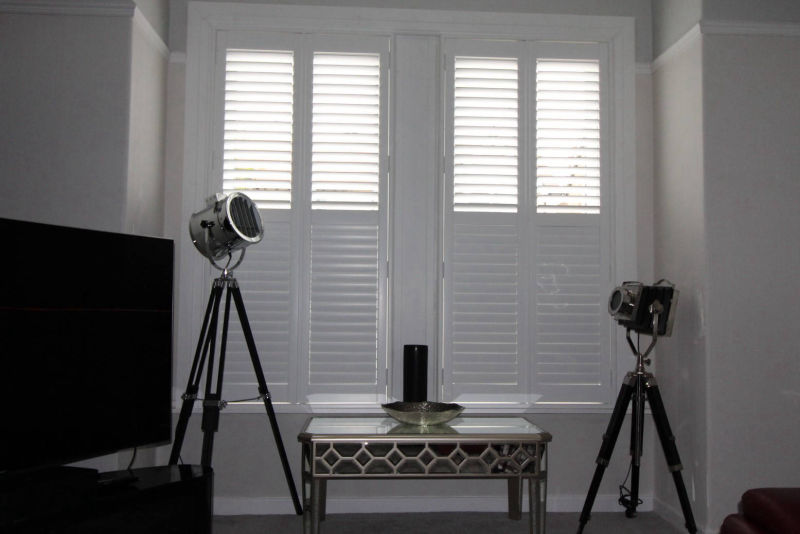 White wooden shutter, inside, half open