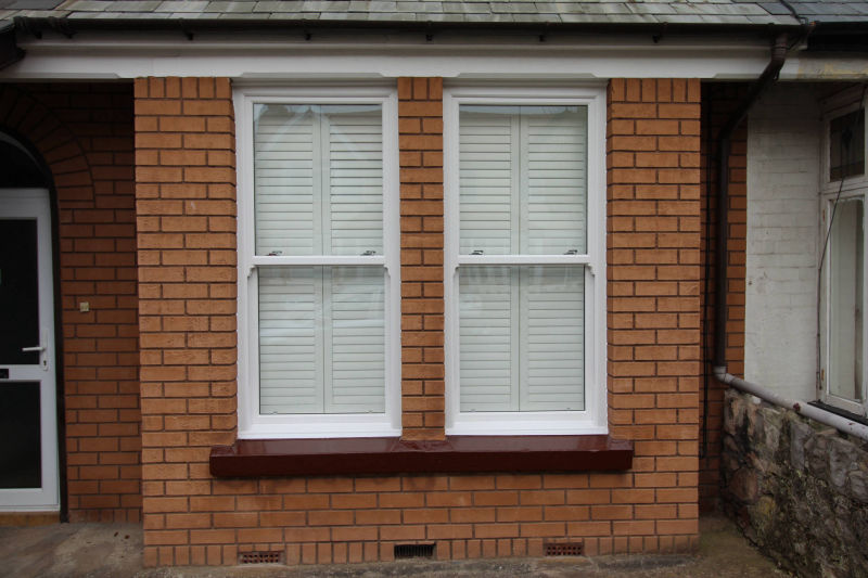 White wooden shutter, outside, closed